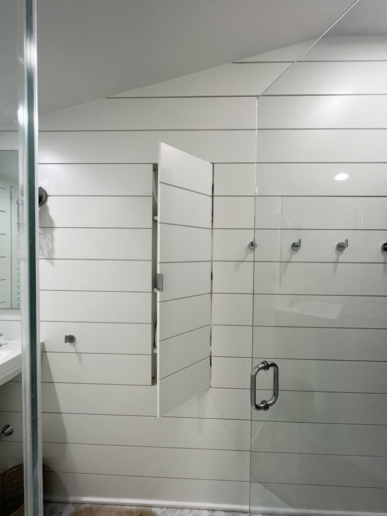 custom hidden bathroom white shiplap cabinet