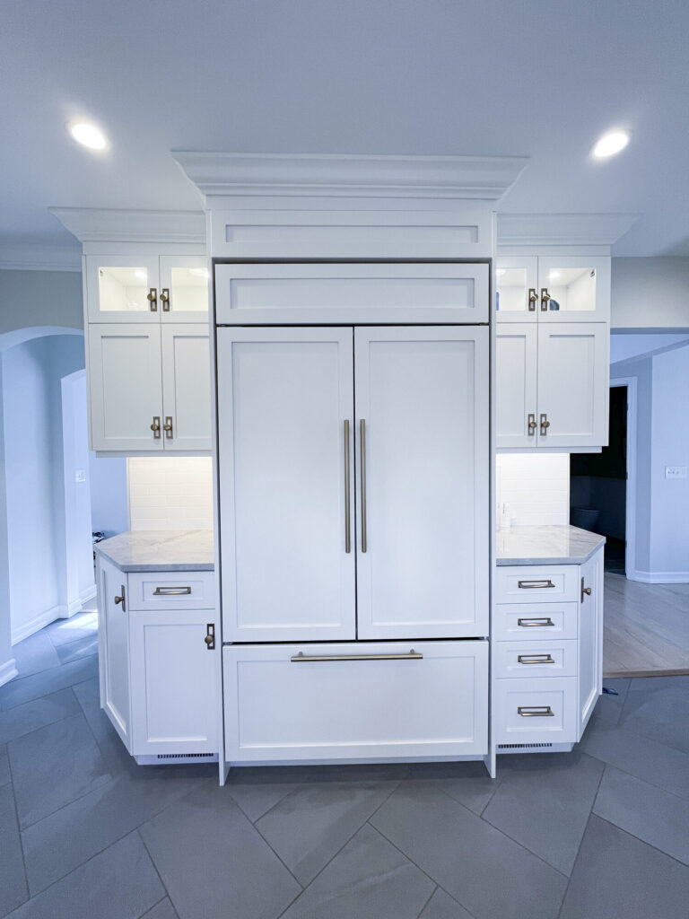 After built-in paneled refrigerator wall