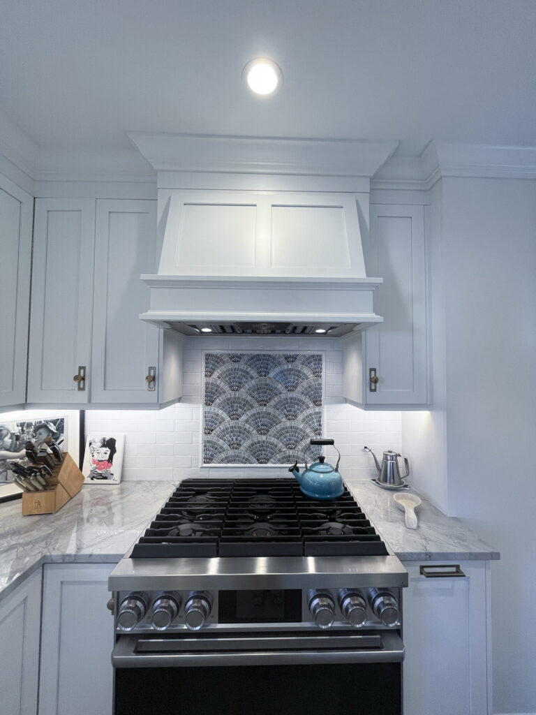 Custom range hood mosaic backsplash