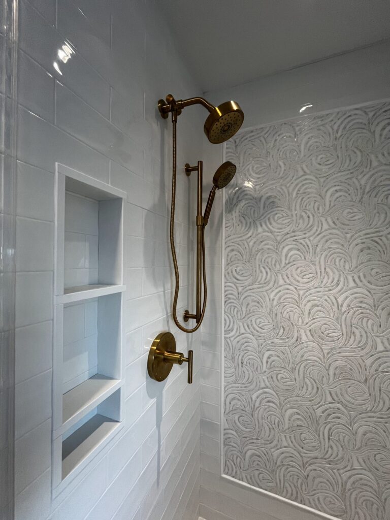 Tiled shower niche brass fixtures